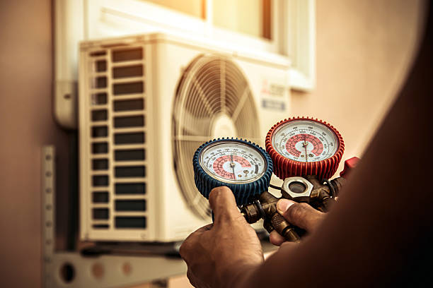 Professional Ac Installation technician working in Woodville, AL